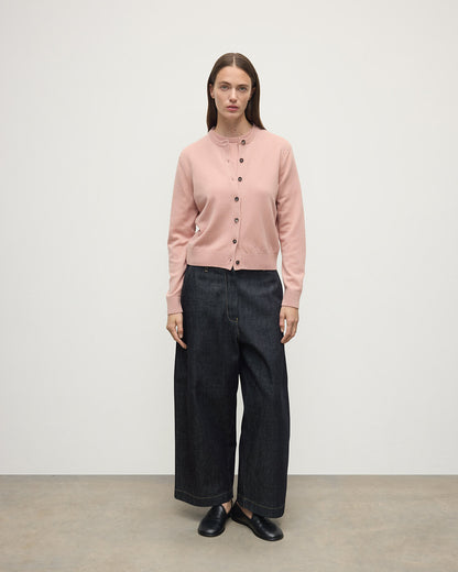 Model wears Johnstons of Elgin AW25 Women's Knitwear Nude Classic Cashmere Pink Cardigan Side KAP05573SE0740