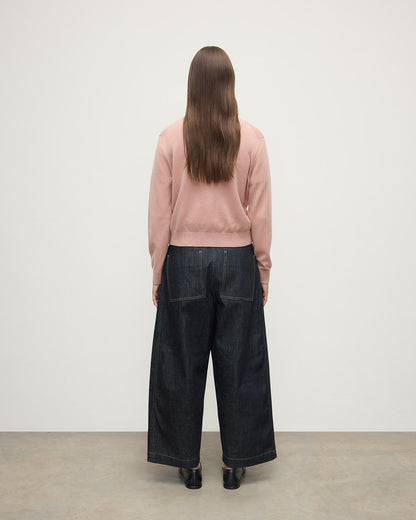 Model wears Johnstons of Elgin AW25 Women's Knitwear Nude Classic Cashmere Pink Cardigan Back KAP05573SE0740