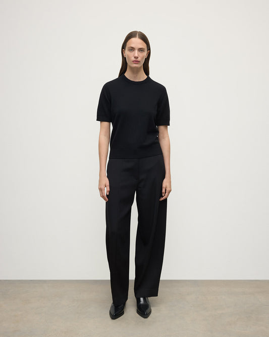 Model wearing Johnstons of Elgin AW25 Women's Knitwear Black Classic Cashmere Black T-shirt Front KAP05574SA7210
