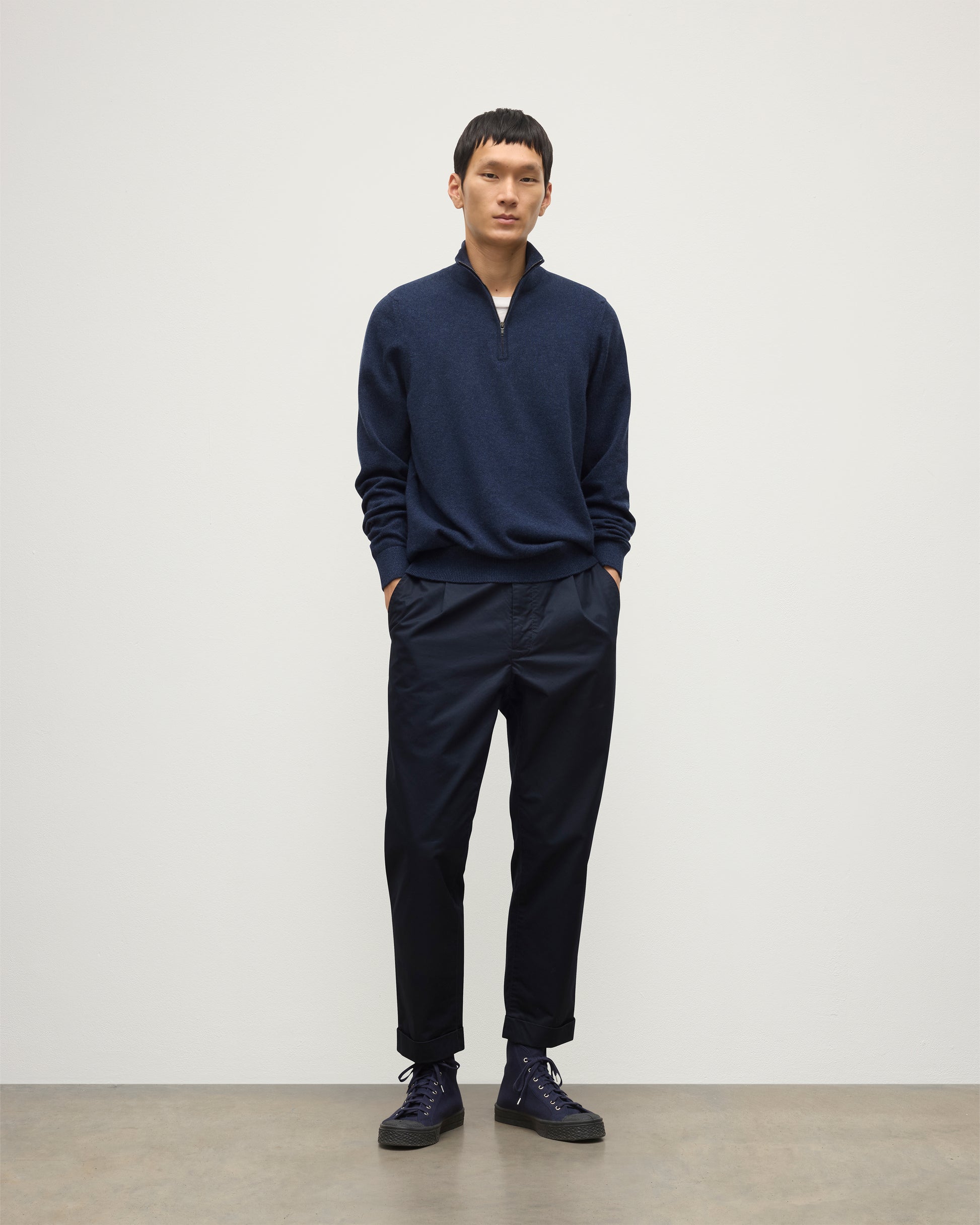 MODEL WEARS JOHNSTONS OF ELGIN MENS RORY CLASSIC HALF ZIP CLASSIC SWEATER 100% CASHMERE  OVER A WHITE T-SHURT WITH NAVY TROUSERS KAP05695HD7350