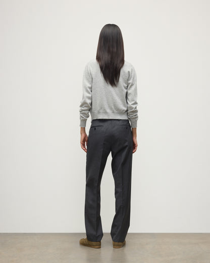 MODEL WEARS JOHNSTONS OF ELGIN WOMENS IRIS CLASSIC CREW CARDIGAN GREY WITH GREY TROUSERS AND TRAINERS  100% CASHMERE KAP05704HA0399