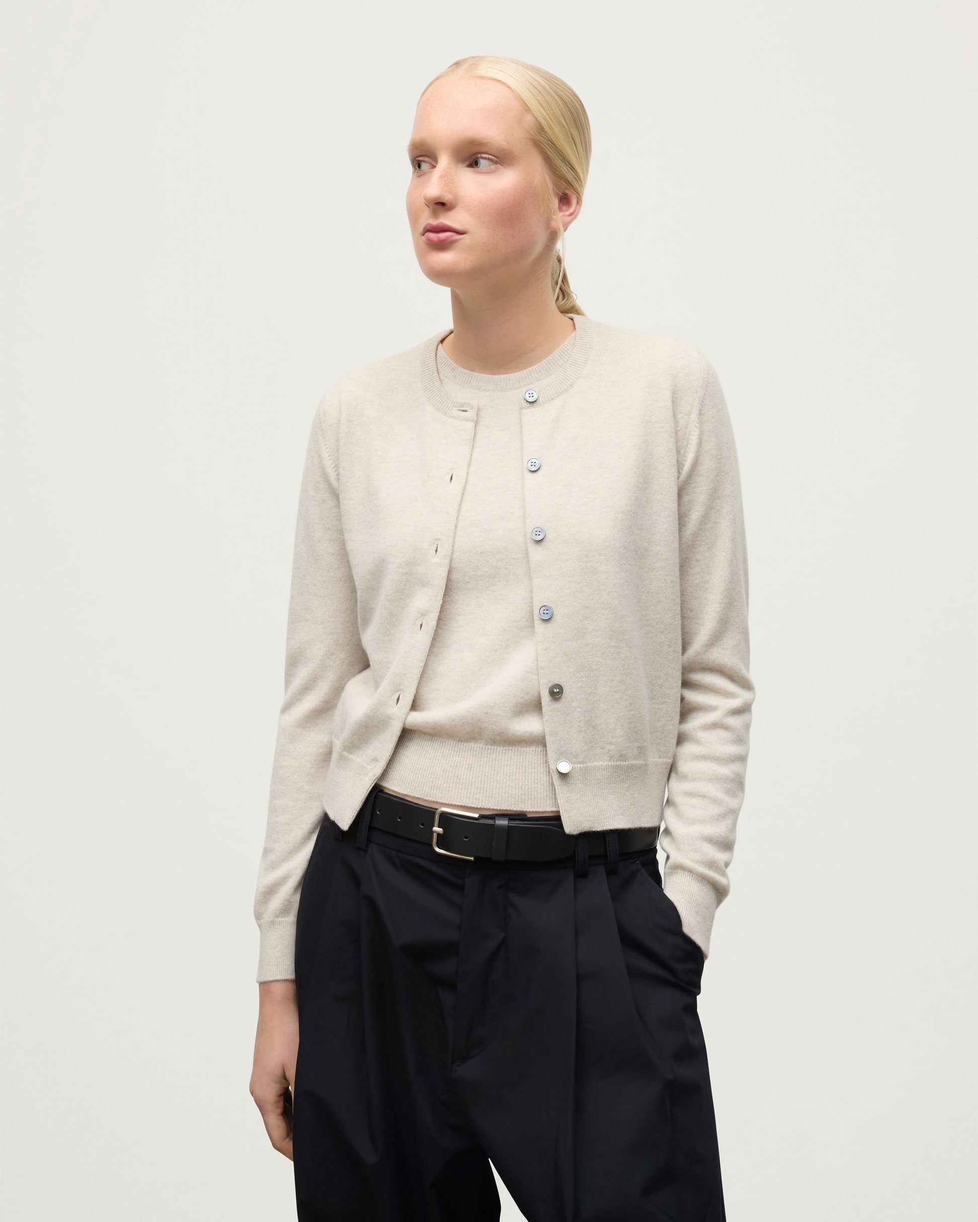 MODEL WEARING JOHNSTONS OF ELGIN WOMENS IRIS CLASSIC CREW CARDIGAN NATURAL 100% CASHMERE KAP05704HA0402
