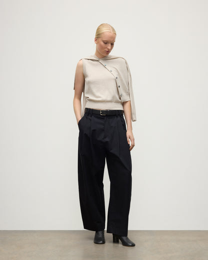 MODEL WEARING JOHNSTONS OF ELGIN WOMENS IRIS CLASSIC CREW CARDIGAN NATURAL 100% CASHMERE OVER MATCHING SLEEVELESS TOP WITH NAVY TROUSERS AND BLACK BOOTS KAP05704HA0402