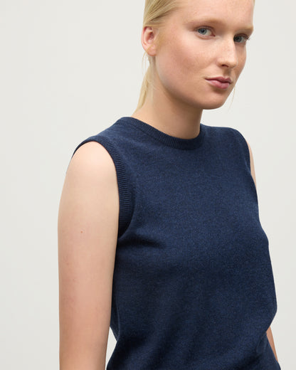 MODEL WEARS JOHNSTONS OF ELGIN WOMENS IRIS CLASSIC SLEEVELESS CREW NAVY 100% CASHMERE KAP05705HD7350