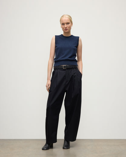 MODEL WEARS JOHNSTONS OF ELGIN WOMENS IRIS CLASSIC SLEEVELESS CREW NAVY 100% CASHMERE KAP05705HD7350