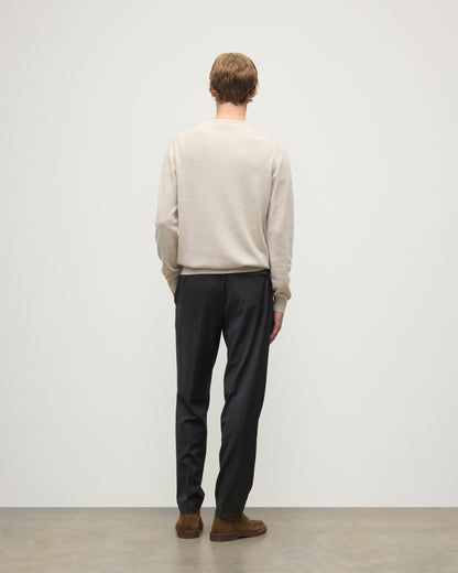 MODEL WEARS JOHNSTONS OF ELGIN MENS ARGYLL CREW SWEATER NATURAL 100% CASHMERE WITH NAVY TROUSERS KAP05747JU1602