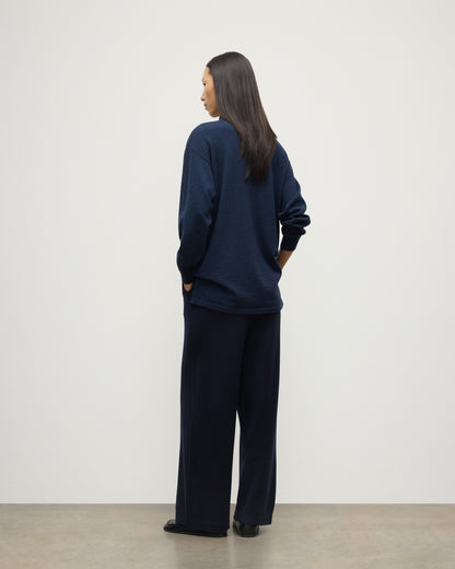 MODEL WEARS JOHNSTONS OF ELGIN WOMENS MUNRO SHIRT NAVY 100% CASHMERE WITH CASHMERE CULOTTES KAP05765HD7350