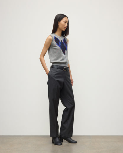 MODEL WEARS JOHNSTONS OF ELGIN WOMENS ARGYLL LE JABOTS SLEEVELESS CREW GREY 100% CASHMERE WITH BELTED GREY TROUSERS AND BLACK BOOTS KAP05766JU1611