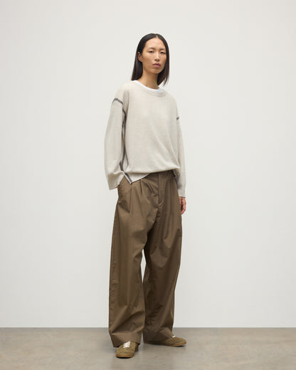 MODEL WEARS JOHNSTONS OF ELGIN WOMENS TILDA CREW SWEATER NATURAL OVER A WHITE T-SHIRT, WITH BROWN TROUSERS KAP05768Q25972