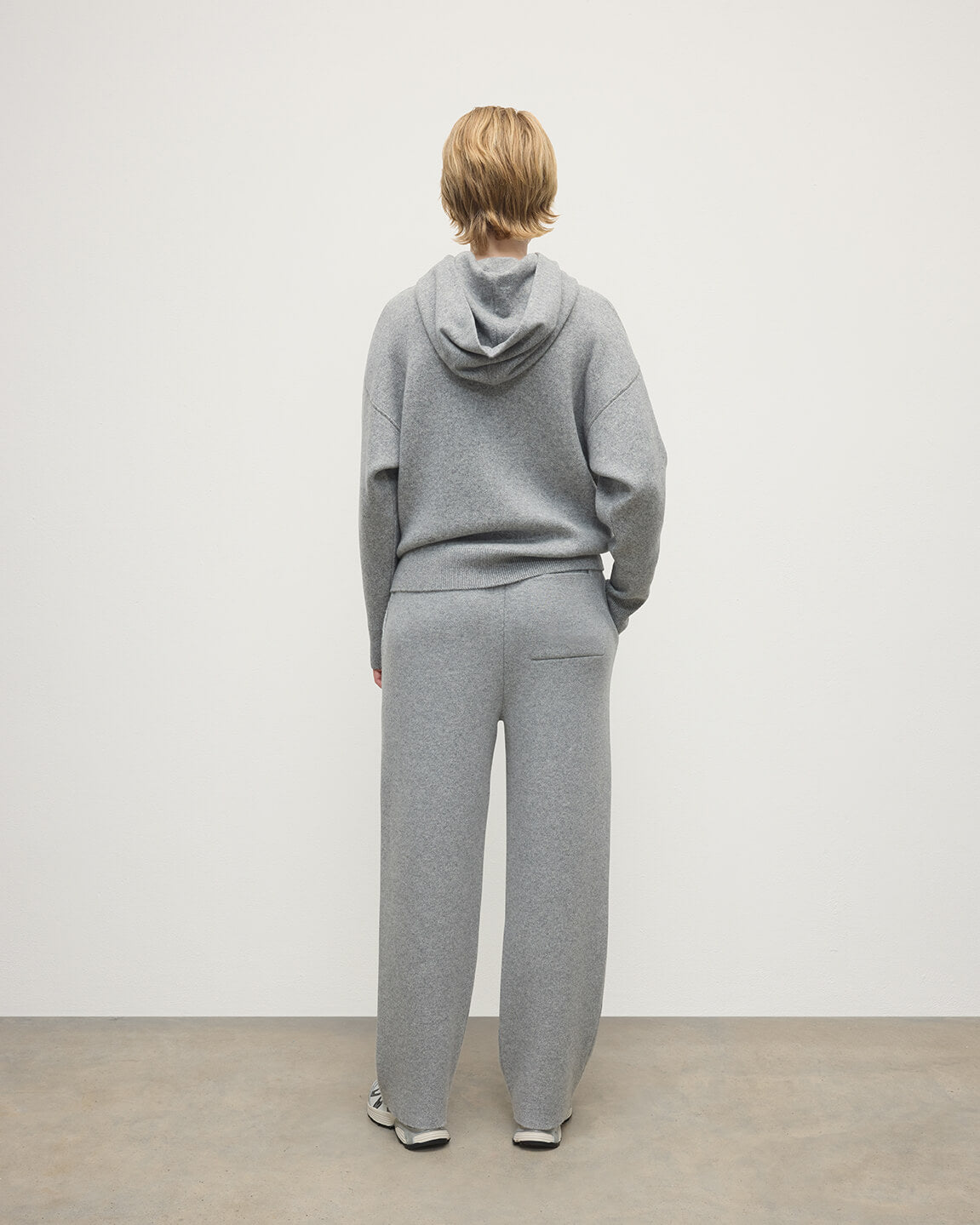 Model wears  Johnstons of Elgin AW25 Women's Knitwear Light Grey & White Double-Face Grey Cashmere Hoodie Back View KBA01034Q25324