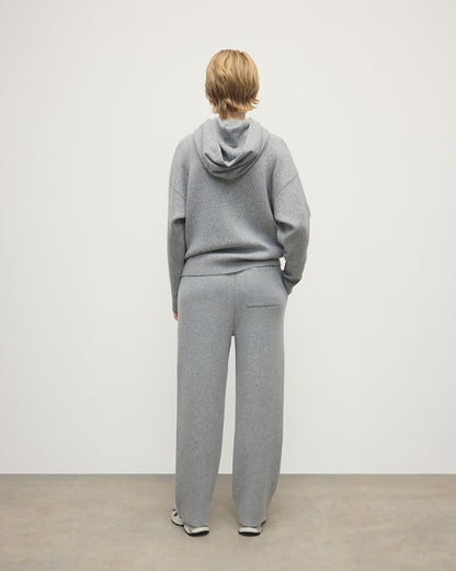 Model wears  Johnstons of Elgin AW25 Women's Knitwear Light Grey & White Double-Face Grey Cashmere Hoodie Back View KBA01034Q25324