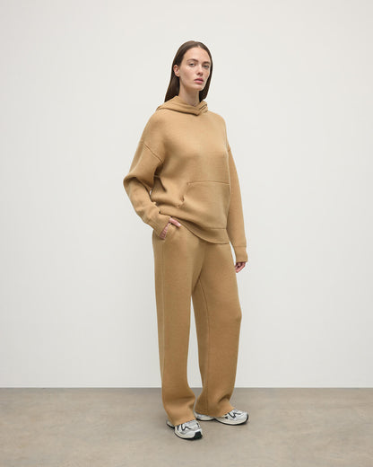 Model wears Johnstons of Elgin AW25 Women's Knitwear Camel & Natural Double-Face Camel Cashmere Hoodie Front View KBA01034Q25325