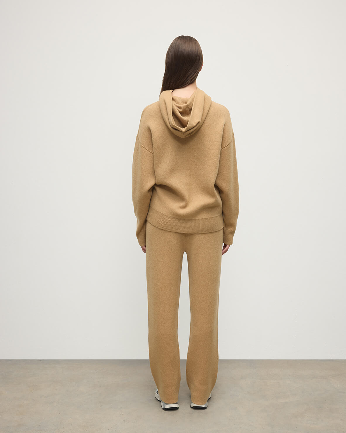 model wearing Johnstons of Elgin AW25 Women's Knitwear Camel & Natural Double-Face Camel Cashmere Joggers Back KBA01036Q25325