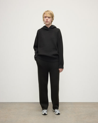 Model wears Johnstons of Elgin AW25 Women's Knitwear Iron & Black Double-Face Black Cashmere Joggers Front KBA01036Q25336