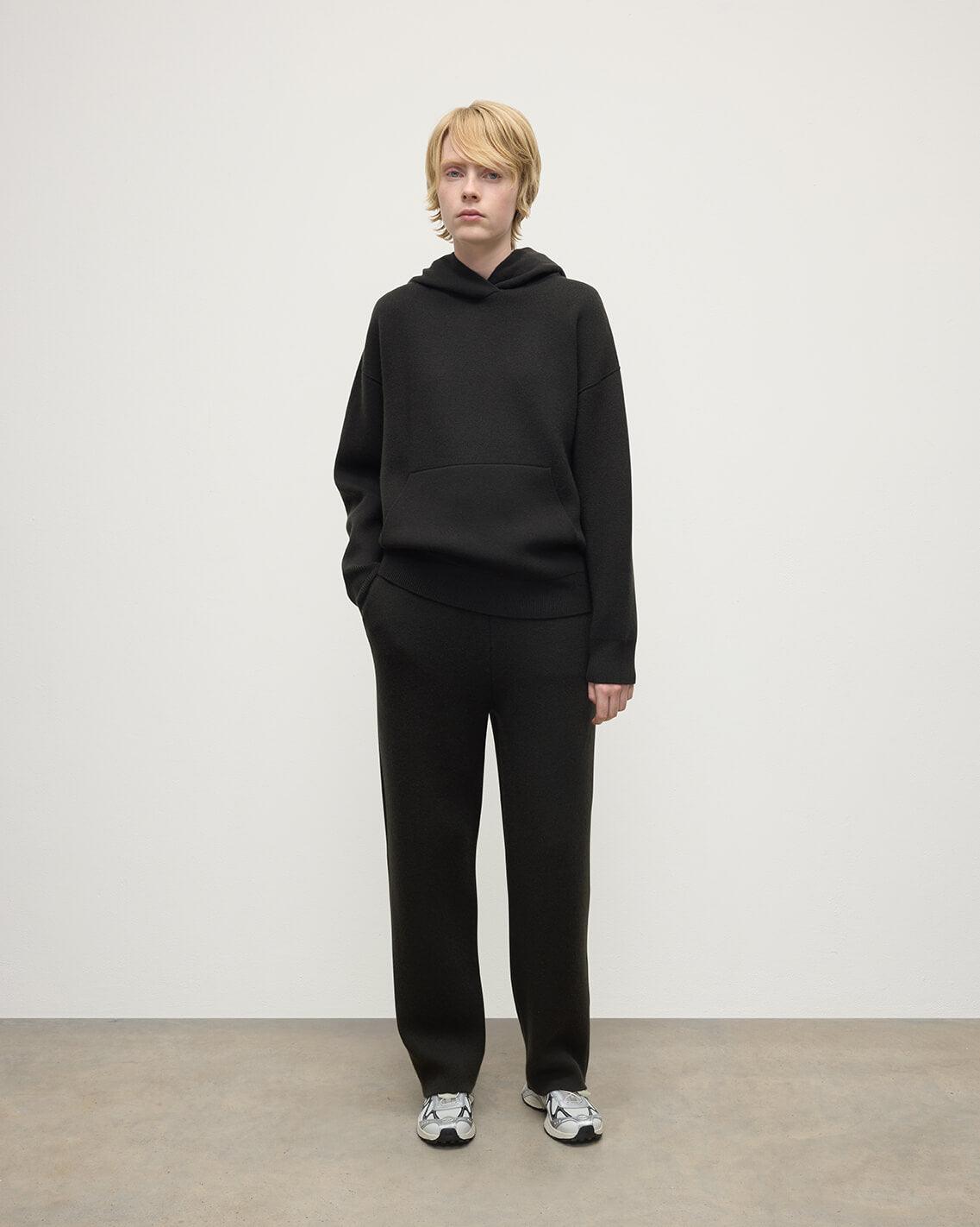model wears Johnstons of Elgin AW25 Women's Knitwear Iron & Black Double-Face Black Cashmere Hoodie Front View KBA01034Q25336