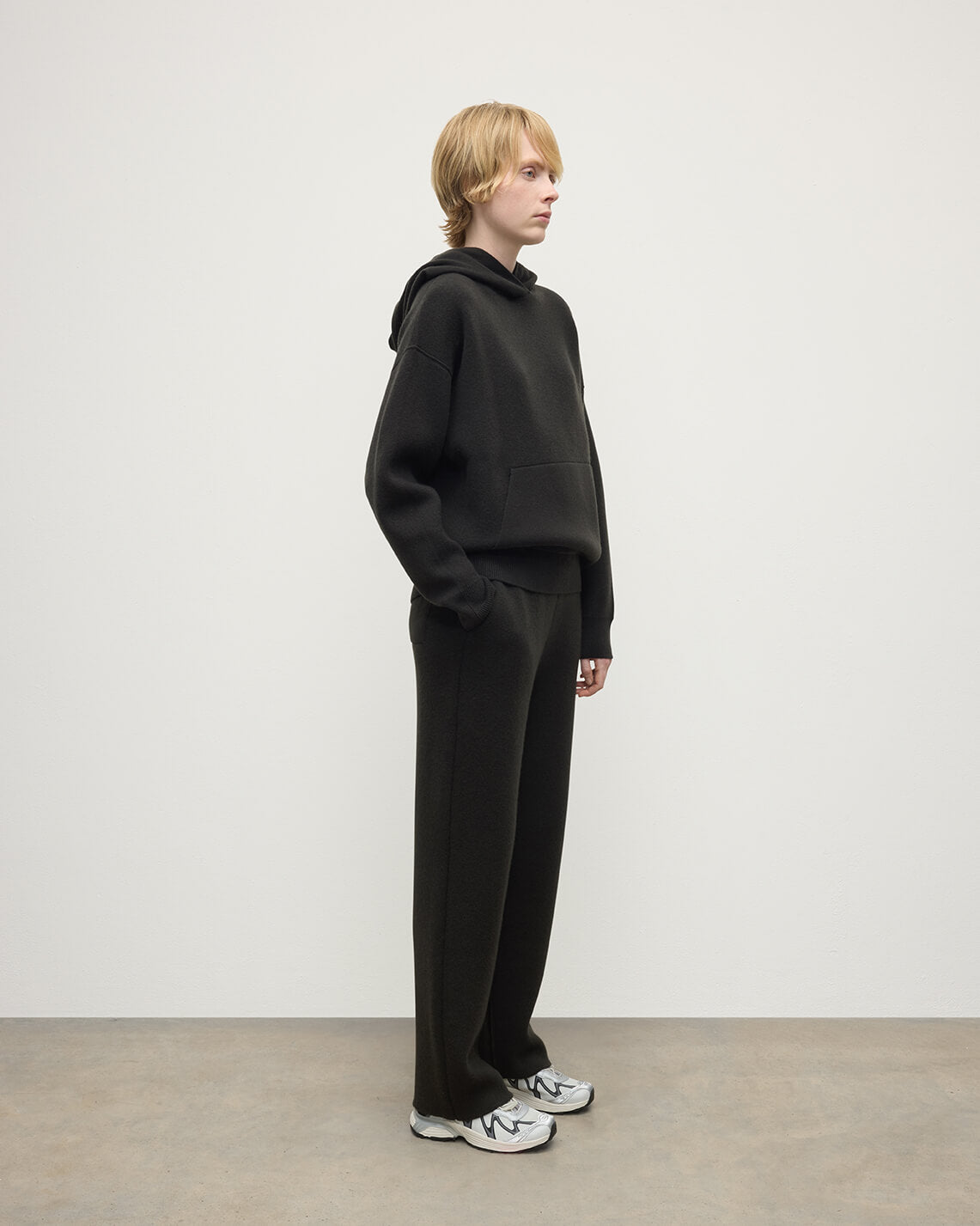 Model wears Johnstons of Elgin AW25 Women's Knitwear Iron & Black Double-Face Black Cashmere Joggers Front KBA01036Q25336