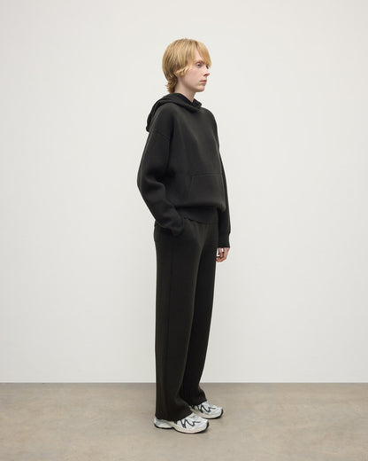 Model wears Johnstons of Elgin AW25 Women's Knitwear Iron & Black Double-Face Black Cashmere Joggers Front KBA01036Q25336
