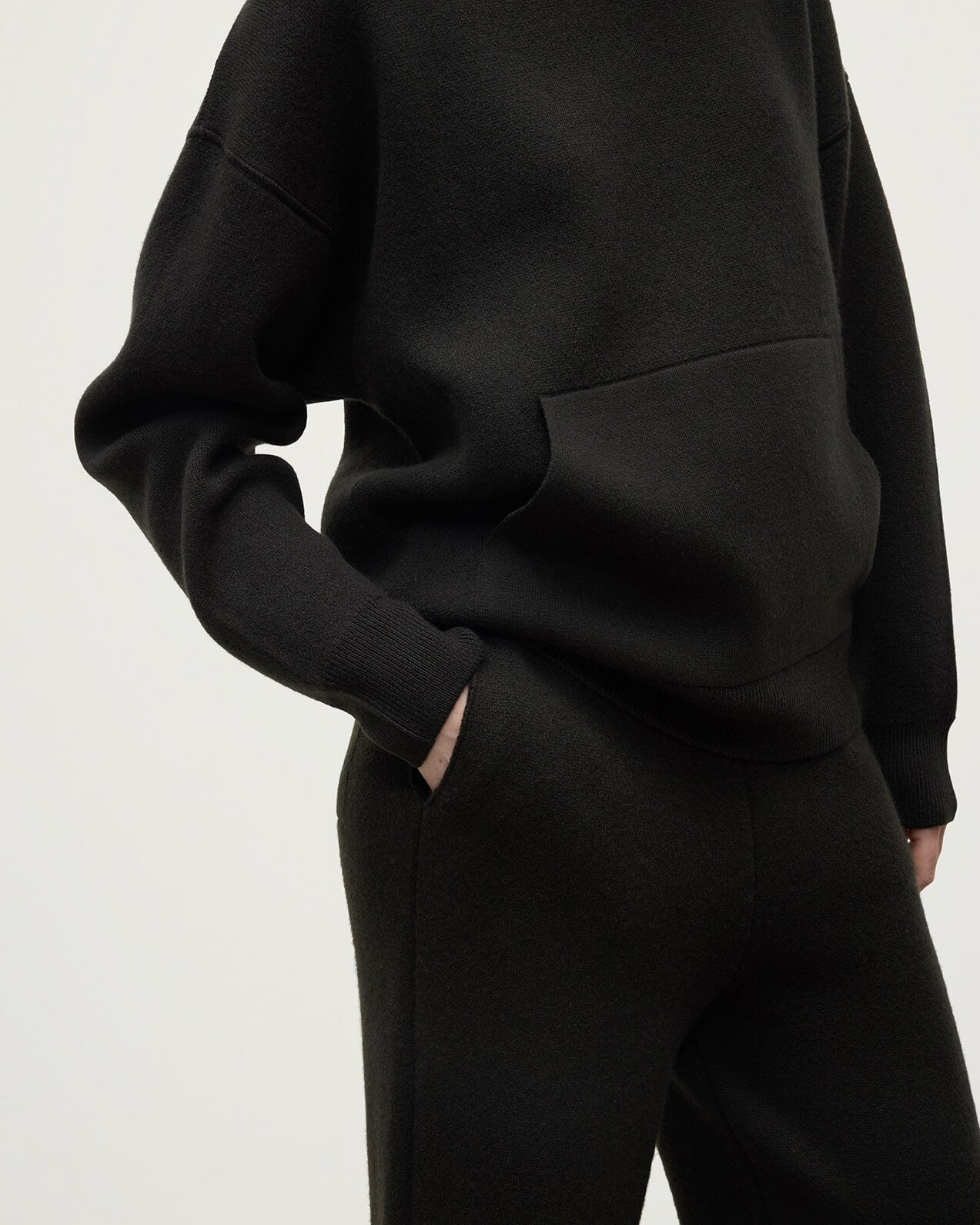 Model wears Johnstons of Elgin AW25 Women's Knitwear Iron & Black Double-Face Black Cashmere Joggers details KBA01036Q25336