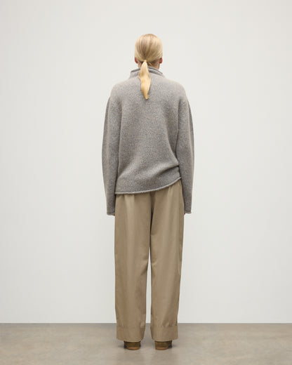 FEMALE MODEL WEARING JOHNSTONS OF ELGIN KESTER FUNNEL NECK SWEATER BLUE 100% CASHMERE UBB01067HD4499