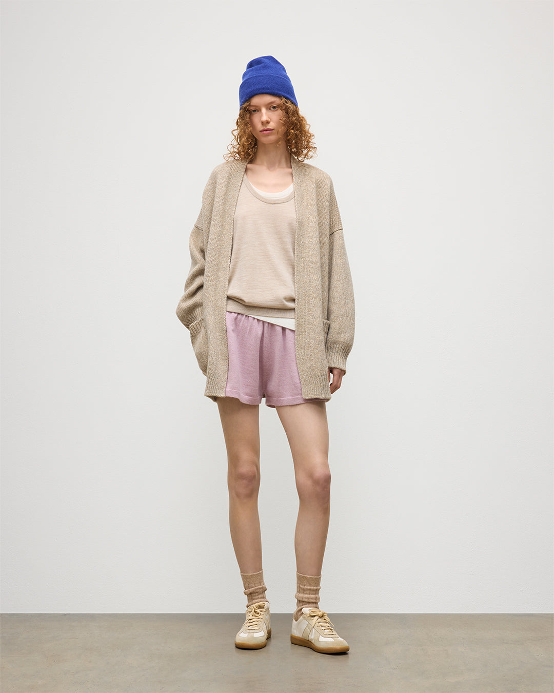 JOHNSTONS OF ELGIN WOMENS BAY SLOUCH CARDIGAN NATURAL 78% CASHMERE 22% COTTON WITH COVE CSAHMERE SHORTS, GREER MERINO VEST, AND BRAEMAR CASHMERE BEANIE IN RONAY BLUE KBB01069HB4453