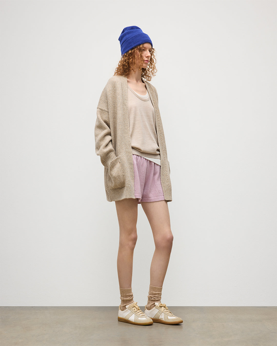 JOHNSTONS OF ELGIN WOMENS BAY SLOUCH CARDIGAN NATURAL 78% CASHMERE 22% COTTON WITH COVE CSAHMERE SHORTS, GREER MERINO VEST, AND BRAEMAR CASHMERE BEANIE IN RONAY BLUE KBB01069HB4453