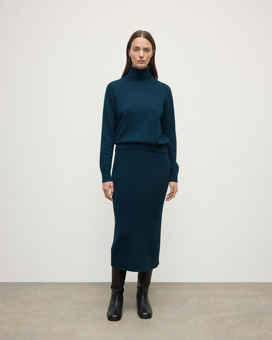 model wears Johnstons of Elgin AW25 Women's Knitwear Bottle Green Cashmere Green Midi Skirt Front View KBC01032SC7341