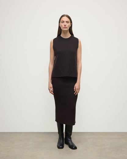Model wears Johnstons of Elgin AW25 Women's Knitwear Molasses Cashmere Brown Midi Skirt KBC01032SB7290