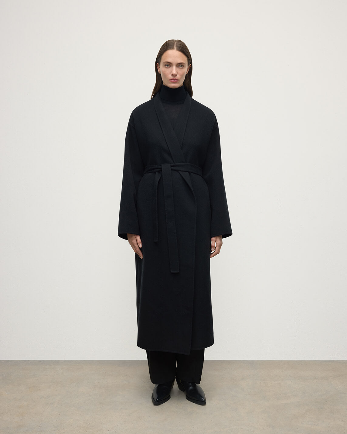 Model wears Johnstons of Elgin Women's Tailoring Black Black Cashmere Wrap Coat Front View TA000621RU6432