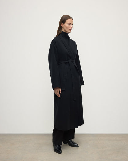 Model wears Johnstons of Elgin Women's Tailoring Black Black Cashmere Wrap Coat Front View TA000621RU6432