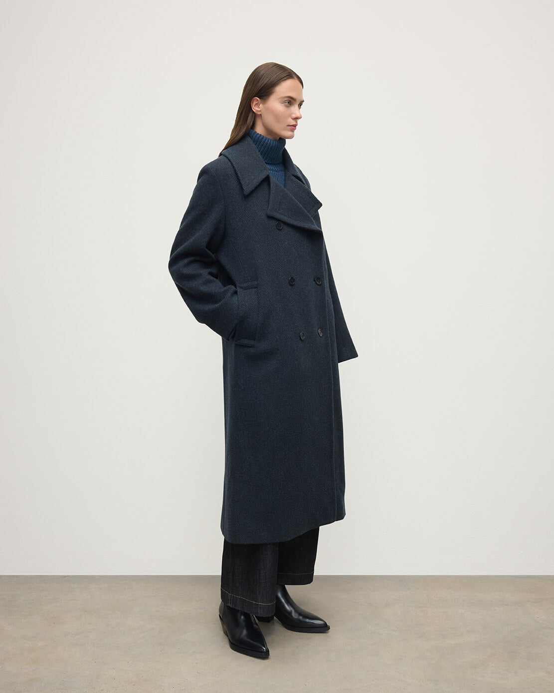 Model wearing Johnstons of Elgin  Women's Tailoring Bottle Dark Twill The Great Coat in Green Front View TD000438RU7672