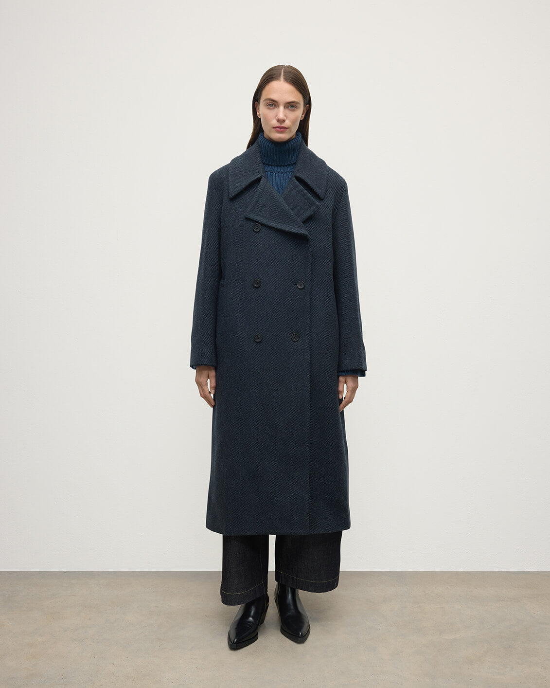 Model wearing Johnstons of Elgin  Women's Tailoring Bottle Dark Twill The Great Coat in Green Front View TD000438RU7672