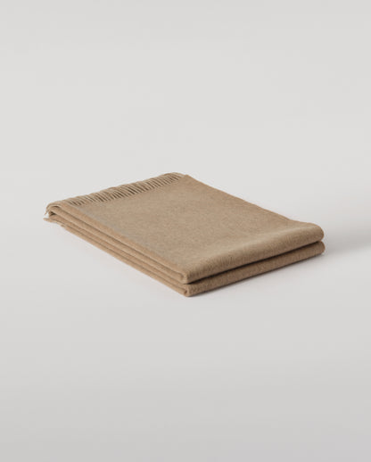 Johnstons of Elgin Interiors Collection Otter & Oatmeal Reversible Cashmere Throw on a grey background  WA000013RU7622ONE