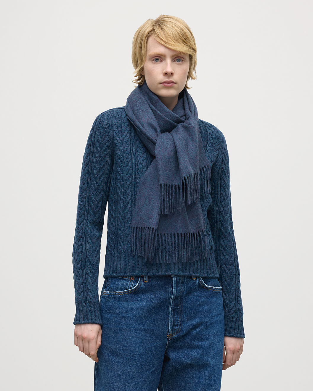 Model wearing Johnstons of Elgin AW25 Woven Accessories Heather Navy Heather Navy Wide Cashmere Scarf WA000057HD7311ONE