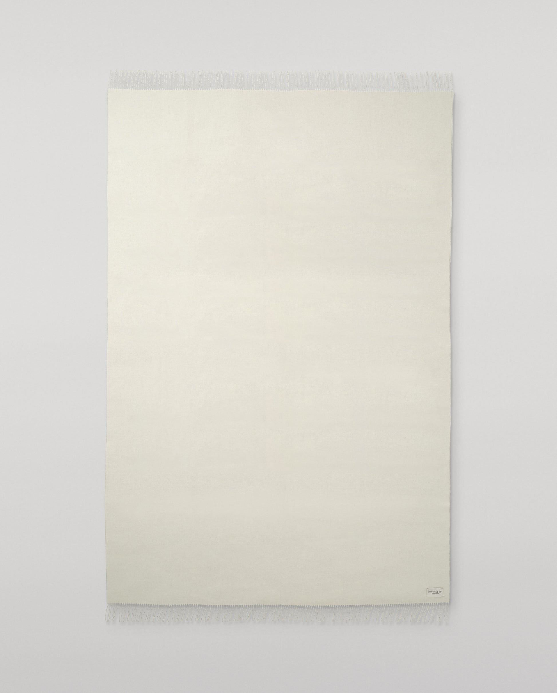 Johnstons of Elgin Interiors Collection Silver & White Reversible Cashmere Bed Throw on a white background  WA001374RU6322ONE