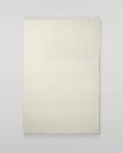 Johnstons of Elgin Interiors Collection Silver & White Reversible Cashmere Bed Throw on a white background  WA001374RU6322ONE