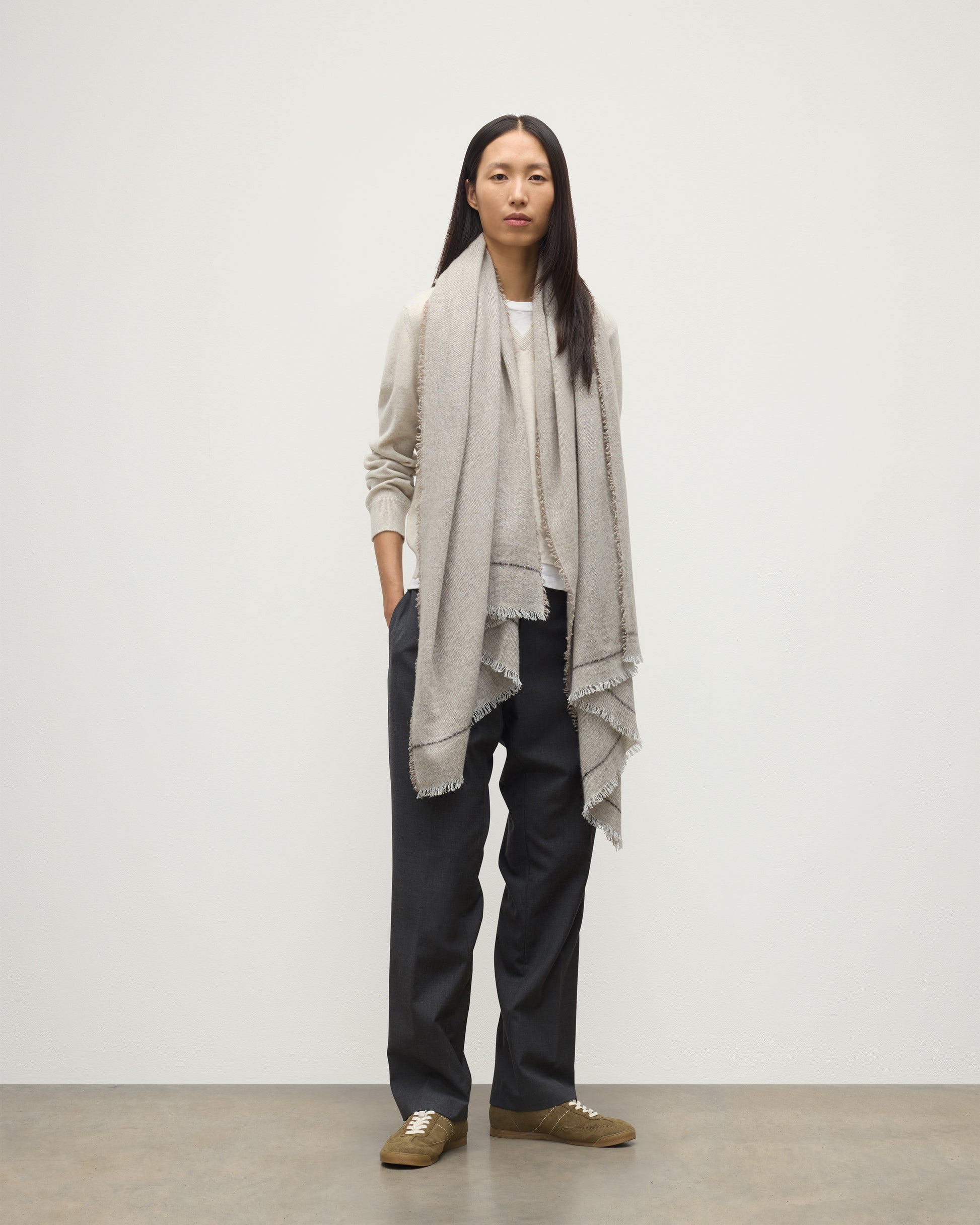 FEMALE MODEL WEARS JOHNSTONS OF ELGIN USAN SEMI PLAIN SCARF NATURAL 100% CASHMERE OVER A NATURAL CASHMERE SWEATER WA002550RU7719ONE