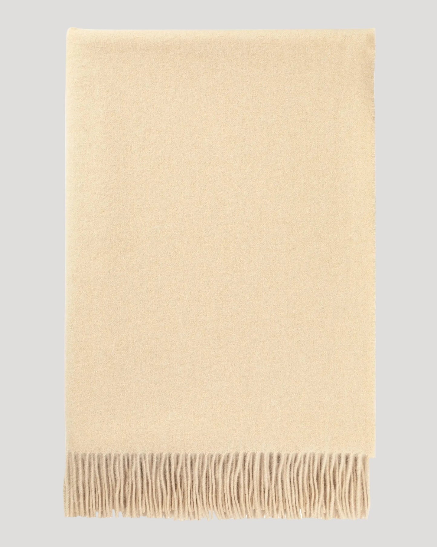 Johnstons of Elgin Interiors Collection Blonde Blonde Cashmere Throw on a white background  WA000055HB0167ONE