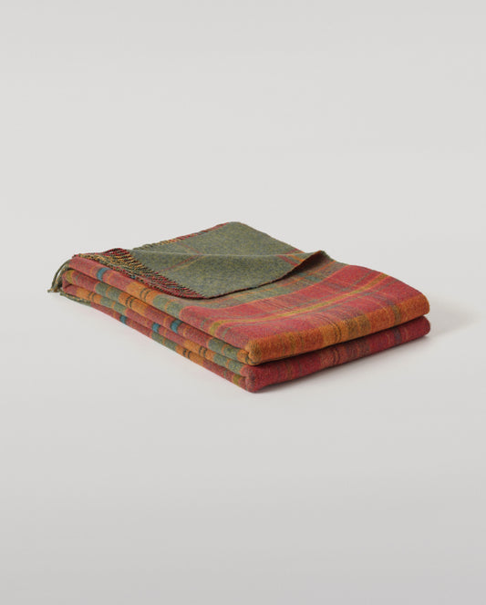 Johnstons of Elgin Interiors Collection Red Tweed & Green Windowpane Reversible Lambswool Throw on a grey background  WD000021XU0036N/A