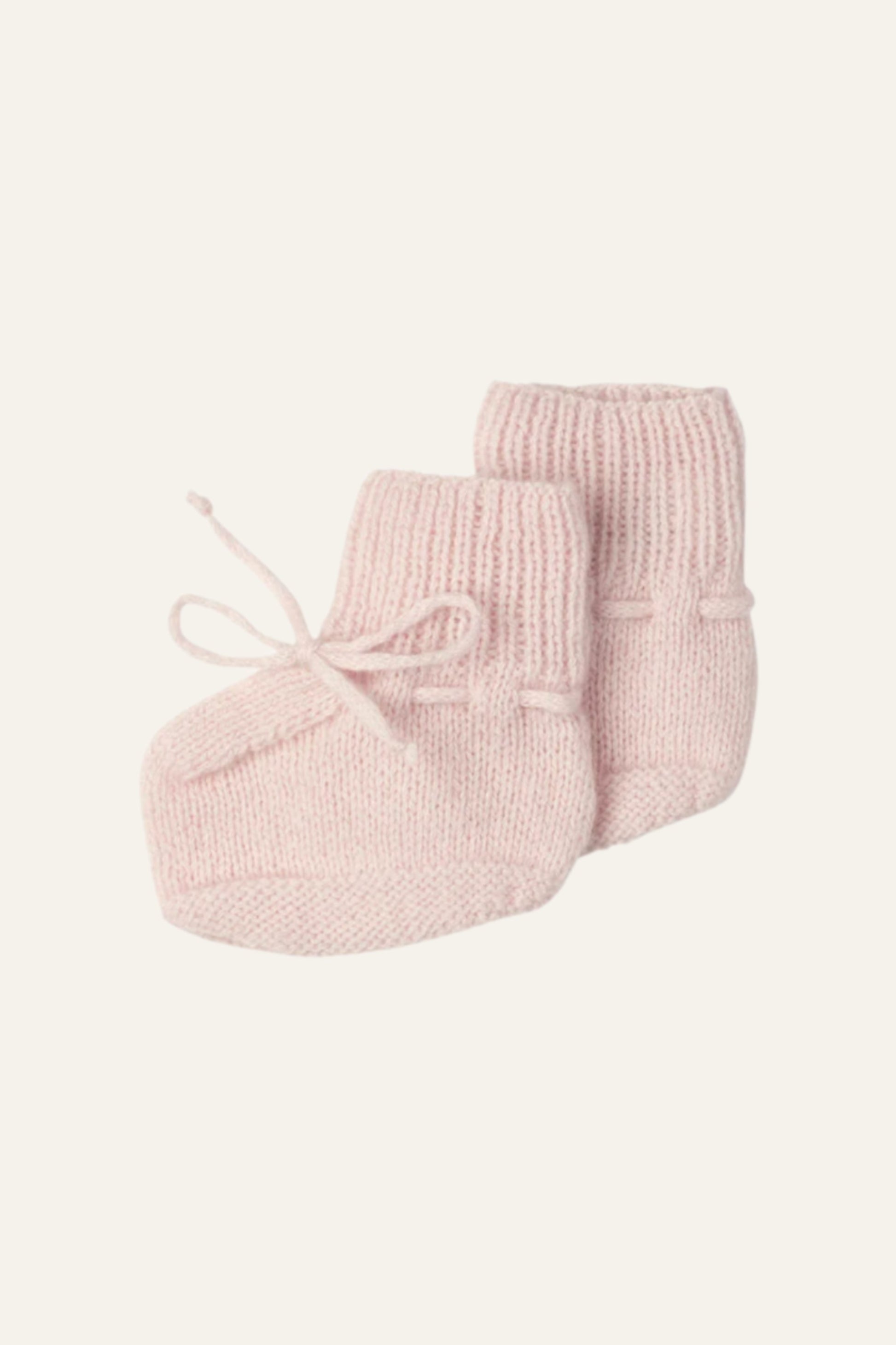 Johnstons of Elgin Hand Knitted Cashmere Baby Booties in Blush on white background JA000114SE0208ONE