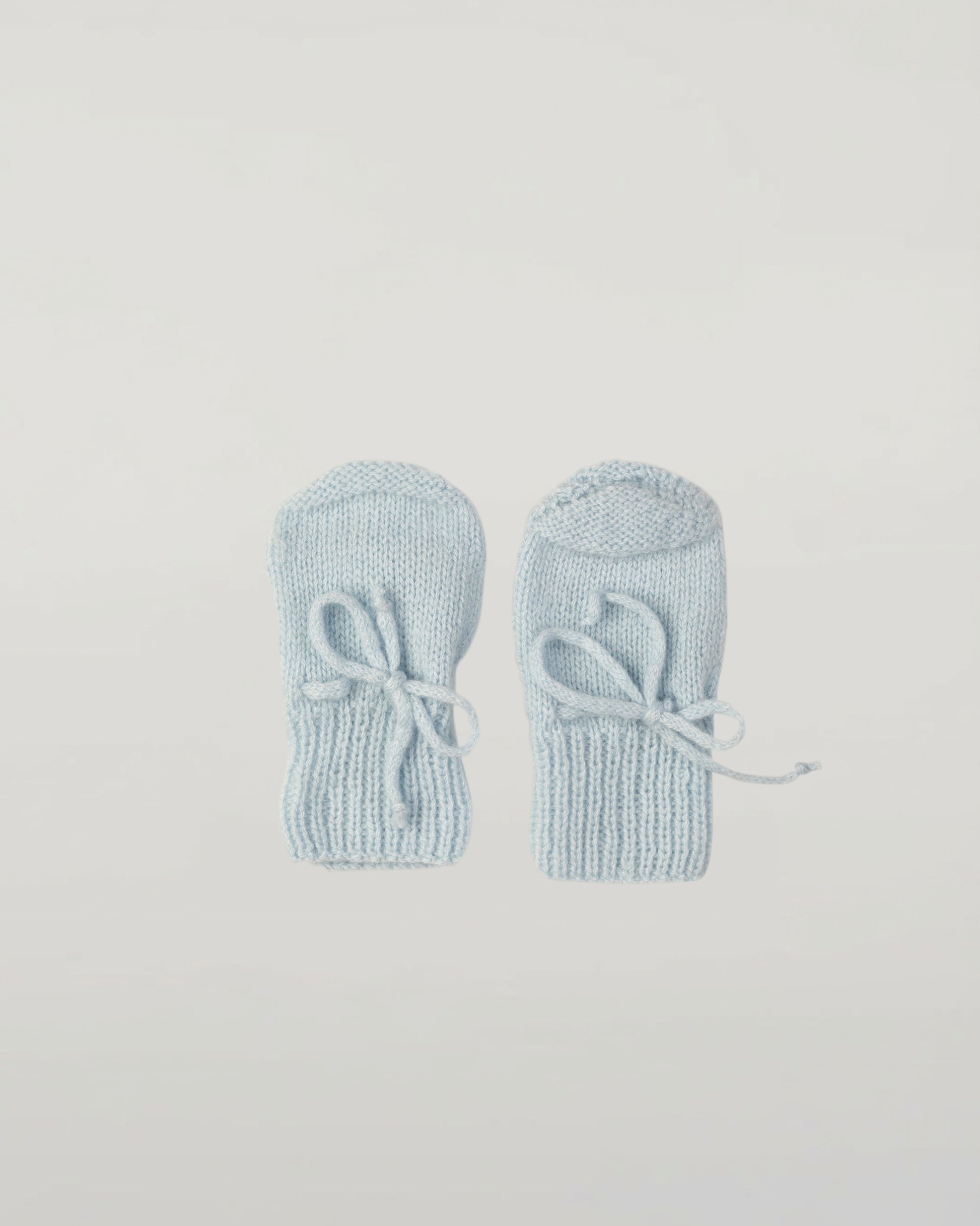 Johnstons of Elgin Hand Knitted Cashmere Baby Mittens in Powder Blue on white background JA000108SD0167ONE