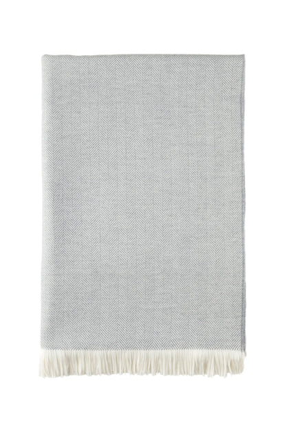 2025 Johnstons of Elgin Interiors Collection Mist & White Herringbone Merino Bed Throw on a white background  WD001115RU5857ONE